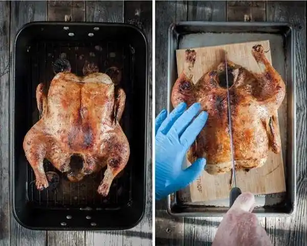 Halbes Hähnchen im Backofen goldbraun gebraten und auf einem Holzbrett mit scharfem Messer in zwei Hälften geteilt.