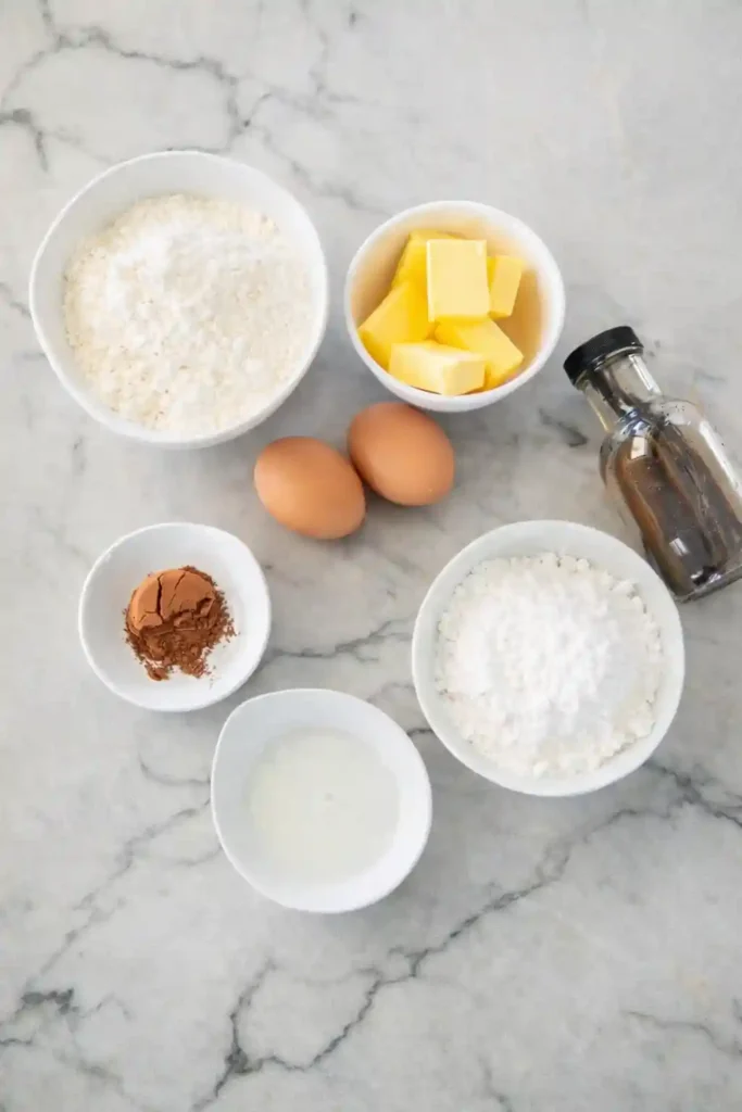 Zutaten für Schwarz-Weiß-Gebäck Rezept nach Omas Rezept – Mehl, Butter, Eier, Kakao, Puderzucker und Vanille für klassische Schwarz-weiß Plätzchen