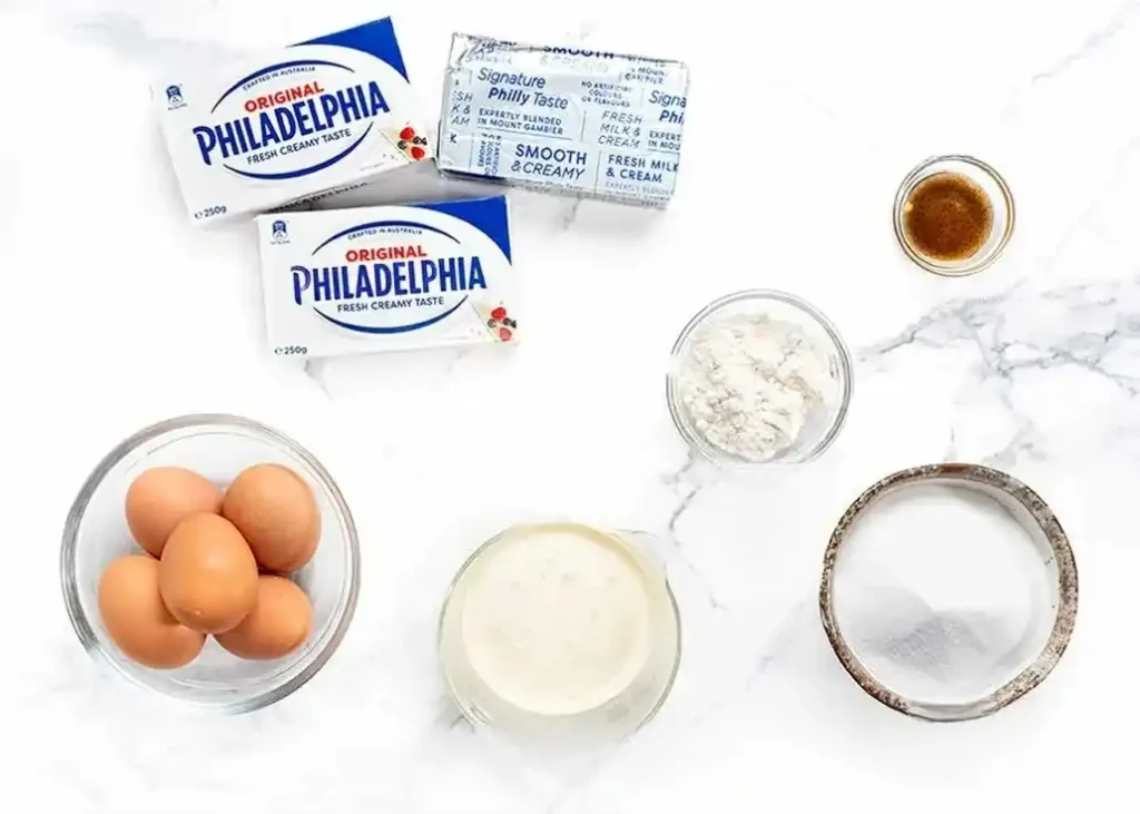 Zutaten für baskischer Käsekuchen original Rezept mit Frischkäse, Eiern, Sahne, Zucker, Mehl und Vanille für San Sebastian Cheesecake