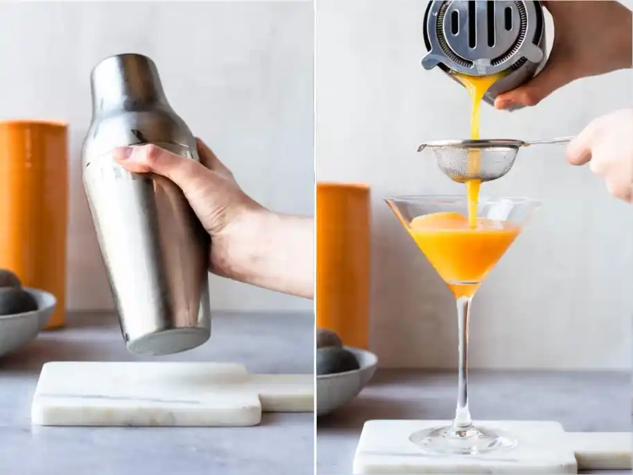Alkoholfreien Pornstar Martini im Cocktailshaker schütteln und durch ein feines Sieb in ein Martini-Glas gießen.